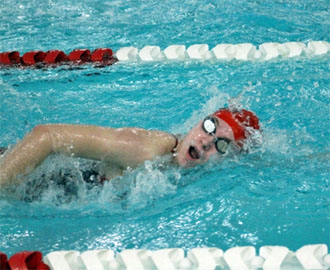 Shown is Peyton Fleming finishing the freestyle leg of her 200-yard individual medley race. (photo submitted)