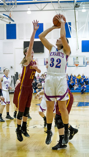 Crestview's Emily Bauer (32) puts in a layup over an Allen East defender is a game won by the Knights, 37-30. (Bob Barnes/Van Wert independent)