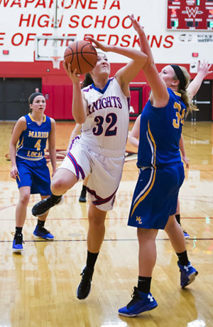 Crestview's Emily Bauer (32) puts up a basket during the Knights' district semifinals game against Marion Local on Thursday. The Knights lost 48-47. (Bob Barnes/Van Wert independent)