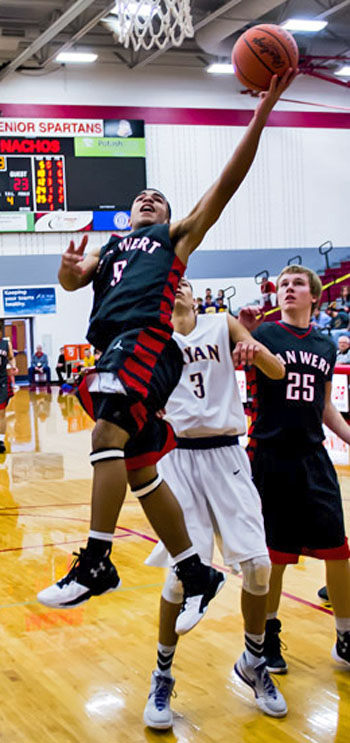 Van Wert's Jacoby Kelly (5) scores two of his game-leading 22 points as the Cougars pull out a 55-54 Division II sectional win over Bryan on Tuesday. (Bob Barnes/Van Wert independent)