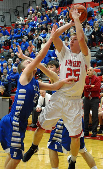 Cougar Davis Munroe (25) shoots in traffic against Defiance in a WBL contest won by the Bulldogs 51-31. ( Jan Dunlap/Van Wert independent)
