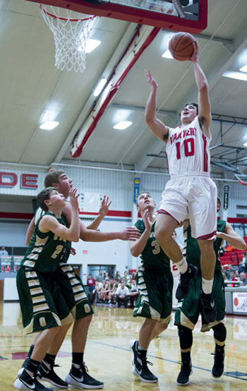 Cougar senior Colin Smith (10) scores two of his 22 points during Friday night's 53-37 non-conference win over Ottoville. (Bob Barnes/Van Wert independent)
