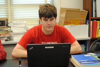 Junior Ford Tatum pays his bills on the H&R Block Budget Challenge Simulation in Knight Time. (Photo submitted.)