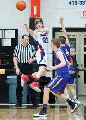 Crestview's Cody Mefferd (22) makes a flashy pass during the Knights' 61-54 win over Leipsic in Tuesday's Division IV district semifinals game at Elida. (Bob Barnes/Van Wert independent)