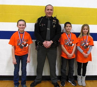 Lincolnview Elementary students participated in the essay contest held by the DARE program. The winners were Zada Walker, Gabe Bill and Taylor Garver. Also pictured is Van Wert County DARE officer, Deputy Mike Biberstine. (Photo submitted.)