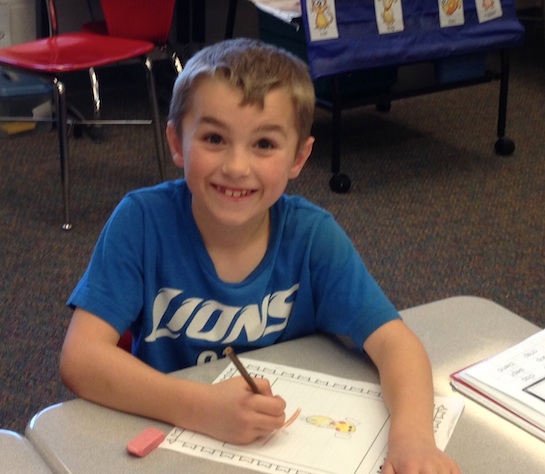 First Grade students in Leigh Short's class at Van Wert Elementary School are writing about the perfect pet. Andrew thinks a dog would be best. (Photo submitted.)