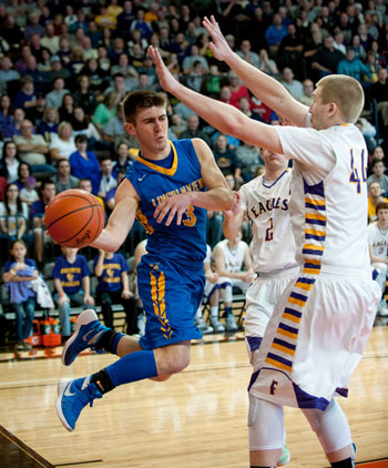 Lincolnview's Austin Leeth (3) passes inside for a basket during the Lancers' 36-29 Division IV Regional semifinals win over Fayette on Tuesday. (Bob Barnes/Van Wert independent)