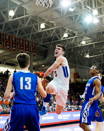 Lancer Austin Leeth (3) drives in for a layup against Mansfield St. Peter's Friday in Lincolnview's 71-51 regional championship win. (Bob Barnes)