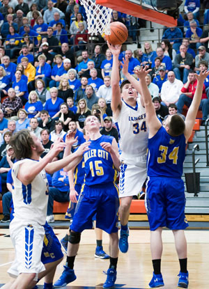 Lancer Hayden Ludwig (34) puts in a basket during Lincolnview's 52-41 victory over Miller City in Tuesday's other Division IV district semifinal game at Elida. (Bob Barnes/Van Wert independent)