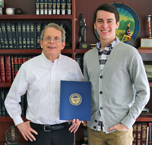 VWHS student Cade Fleming (right) accepts his third-place award from Ohio Attorney General Mike DeWine. (photo submitted)