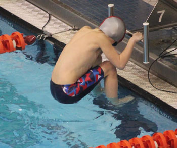 Marlin Sam Easley gets ready to swim the 25-yard backstroke during the team's participation in the Northwest Ohio YMCA Championships at Bowling Green State University. (photo submitted)