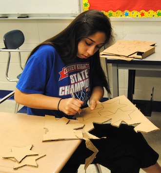 Junior Kalissa Leal cuts out stars in her free time at school to decorate for prom at Willow Bend. (Photo submitted.)