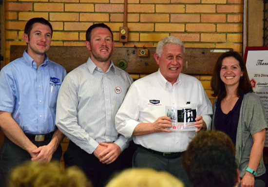 Members of the Straley Realty team, which won the "Outstanding Building Rehab" award at Monday night's Main Street Van Wert annual dinner, pose with presenter Sara Zura. (Dave Mosier/Van Wert independent)