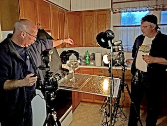 Tracy Sterling, (left) prepares to drop a strawberry into Sprite while Randy Shellenbarger is ready to capture its impact. (Photo submitted.)