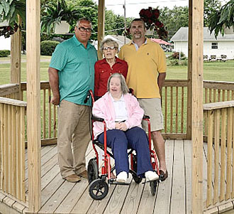 Members of Glen Jenkins' family (above) were on hand to dedicate a gazebo in his honor on the grounds of St. Mary of the Assumption Catholic Church. (photo submitted)