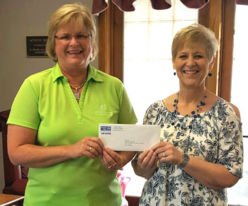 United Way of Van Wert County Executive Director Vicki Smith (right) presents Molly Hey of Big Brothers Big Sisters of Mercer, Auglaize, and Van Wert Counties with a check for $1,500.