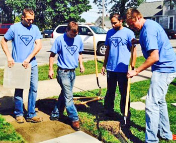 Four members of the 2016 Leadership Van Wert County Class tackle a project at the YWCA as part of their United Way Day of Caring Project. (photo submitted)