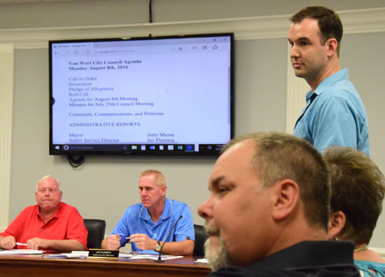 Main Street Van Wert Program Manager Adam Ries (standing) listens to a comment from Third Ward Councilman Ken Markward on a request to move the Harvest Moon Festival to the 100 block of East Main Street. (Dave Mosier/Van Wert independent)