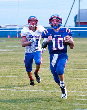 Crestview quarterback Drew Kline (10) legs the ball into the end zone for a TD during Friday's 42-0 win over the Raiders. Bob Barnes/Van Wert independent)