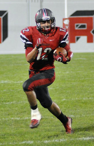 Van Wert's Nick Gutierrez (12) finds some running room in Friday's WBL contest won by Shawnee on a TD with time expired. Jan Dunlap/Van Wert independent