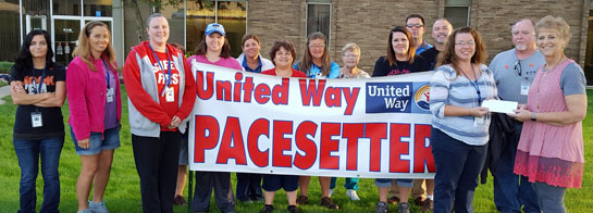 Eaton employees with United Way Executive Director Vicki Smith (right). (United Way photo)