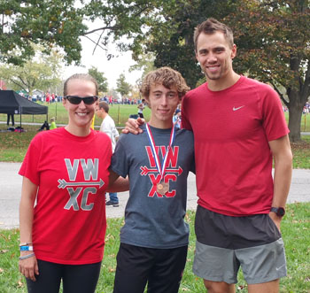 Van Wert Cross Country Coach Ryan Holliday with state meet qualifier Cal Wolfrum (center) and Cougar girls' top runner Jerica Huebner (photo submitted)
