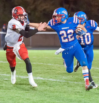 Crestview's Trevor Gibson (22) stiff-arms a Bluffton defender on a run in Friday's game at home. The Knights won 41-21. Bob Barnes/Van Wert independent