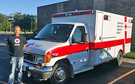 Local volunteer Rodney Knauss is shown with the local Red Cross disaster vehicle. (Red Cross photo)