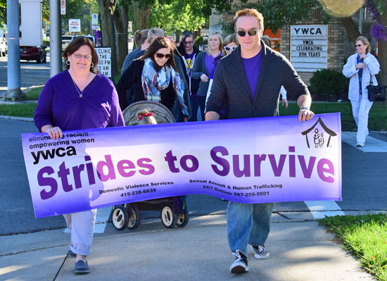 Local residents walk Saturday in the YWCA's Strides to Survive domestic violence awareness program. Dave Mosier/Van Wert independent
