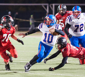 Crestview quarterback Drew Kline (10) finds running room against Arlington in Saturday's Division VII playoff game at Lima. Bob Barnes/Van Wert independent