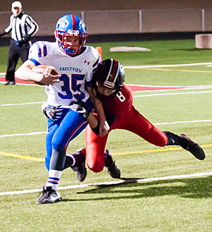 Knight running back Payton Knittle (35) runs for positive yardage against Arlington. Bob Barnes/Van Wert independent