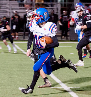 Crestview quarterback Drew Kline (10) runs for a touchdown against McComb in Saturday's District VII regional playoff at Lima Senior. Bob Barnes/Van Wert independent