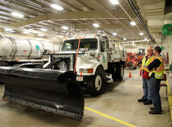 Dave Scheckelhoff (left), fleet manager for ODOT District 1; and Larry Honingford, mechanic at the ODOT Van Wert County garage, discuss equipment during the annual snow plow inspection at the garage on Tuesday. (ODOT photo)