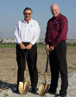 Paulding Putnam Electric Cooperative Board Chair Dr. John Saxton and PPEC President/CEO George Carter break ground on the cooperative’s OurSolar solar power initiative. (photo submitted)