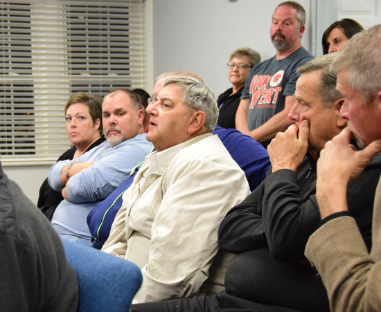 Van Wert Area Convention & Visitors Bureau Executive Director Larry Lee (in light jacket) speaks in support of allowing non-profit groups to sell alcohol on public property during Monday's City Council meeting. Dave Mosier/Van Wert independent