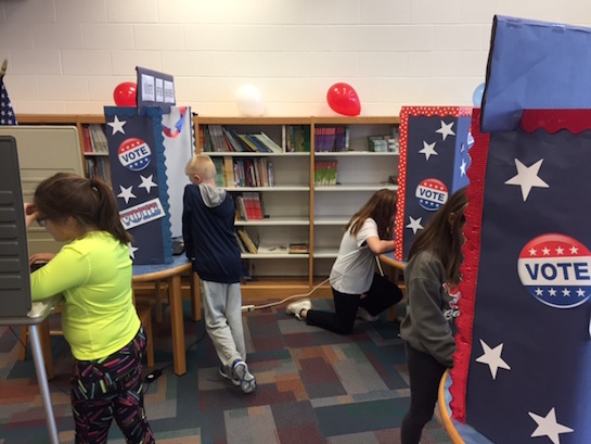 Van Wert Elementary School students are voting on the Buckeye Book Award this week during library class. Over the past few weeks, students have heard five different book nominations in their age category. This week, students will vote for the one that they think should win the statewide award. Thanks to the Van Wert Board of Elections, students get to use a real voting booth as well as get a sticker when they complete their vote.  (Photo submitted.)