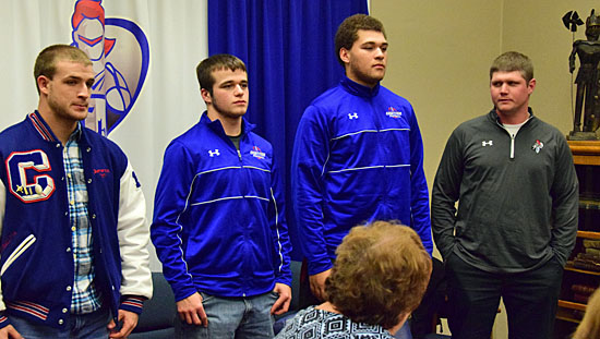 Crestview Head Coach Jared Owens (standing right) introduces football players (from the left) Luke Gerardot, Braden Van Cleave, and Chase Clark during Thursday's meeting of the Crestview Local Board of Education. Dave Mosier/Van Wert independent