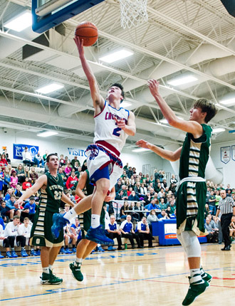 Crestview's Drew Kline (2) goes way up for a layup during Tuesday's non-conference boys' basketball game with Ottoville. The Big Green edged the Knights 52-49 in the game. Bob Barnes/Van Wert independent