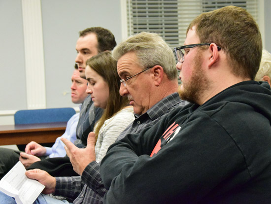 Kurt Schalois (second from right, a board member for the Van Wert Area Chamber of Commerce, reads a statement from the Chamber supporting limited liquor sales on public property. Dave Mosier/Van Wert independent