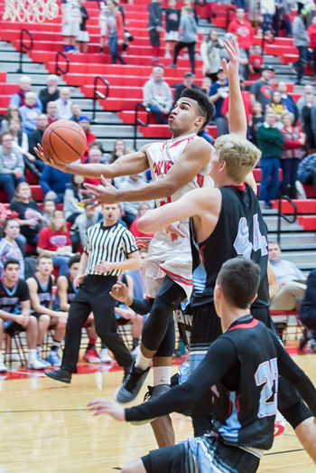 Van Wert's Jacoby Kelly (5) drives for a layup against LCC on Friday in a game the Cougars won 66-45. Bob Barnes/Van Wert independent