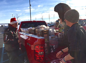 Vantage students load toys into a pickup truck. (Vantage photos)