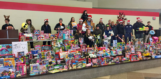 Vantage VCC Class students with the Christmas gifts purchased with school donations.