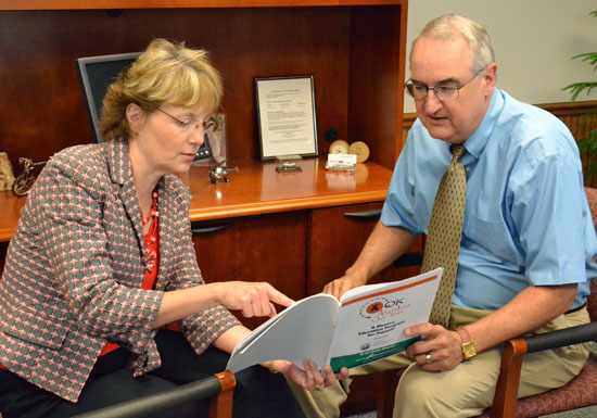 Family counselors Susan Burchfield and Jules Krizan look over information on the A-OK divorce dispute resolution program they created nearly 25 years ago. Dave Mosier/Van Wert independent