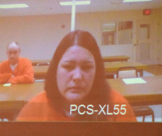 Abby Thatcher enters pleas through a video arraignment on Wednesday, while co-defendant Ronald Smith is shown in the background. Dave Mosier/Van Wert independent
