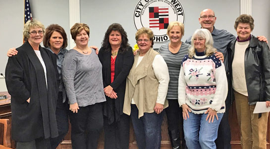 Retiring dispatcher-records clerk Oribel Perl (in dark jacket) posed with a group of current and former dispatcher colleagues who, together, have 250.5 years of experience. (photo courtesy of Kim Brandt)