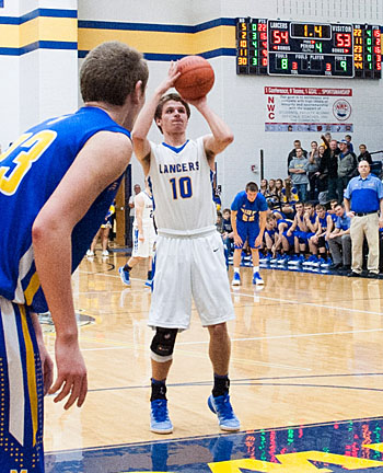 Lincolnview's Ethan Kemler (10) prepares to make the front end of a 1-and-1 to give the Lancers a 55-53 win over Miller City. Bob Barnes/Van Wert independent