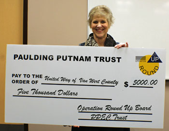 United Way of Van Wert County Executive Director Vicki Smith holds a large check representing the organization’s receipt of $5,000 from the Paulding Putnam Electric Cooperative’s Operation Round-Up program. (photo submitted)