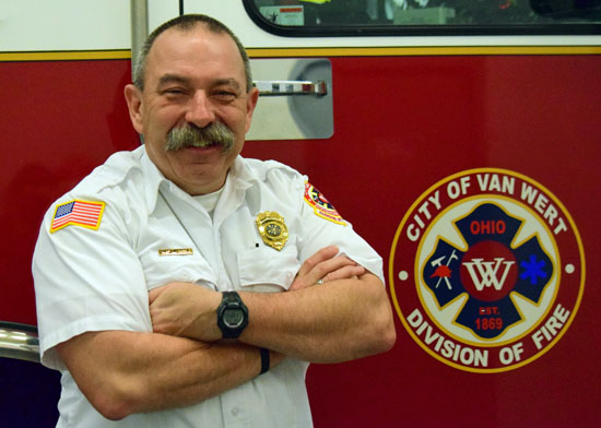 Van Wert Fire Chief Jim Steele is shown in front of one of the department's fire trucks. Dave Mosier/Van Wert independent