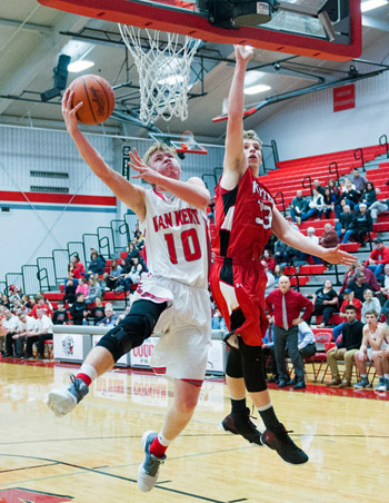 Van Wert's Nate Place (10) puts in a layup over a Kenton defender during Friday's WBL contest against the Wildcats. Bob Barnes/Van Wert independent