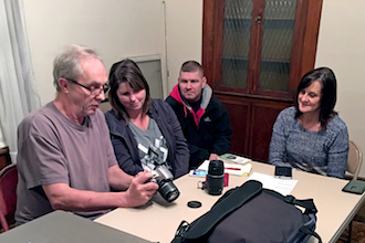 VWAPC member Larry Dickerhoof points out camera features to Bev Boroff as hubby, Rick, and member Barb Jewett listen in. (Photo submitted.)